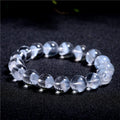 Women's natural white ghost pyramid bracelet with ground crystal beads and Ruyi design element