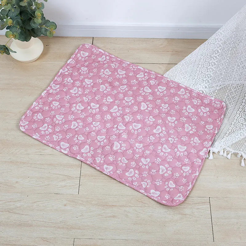 Reusable washable pet urine pad with animal print design and waterproof layer.