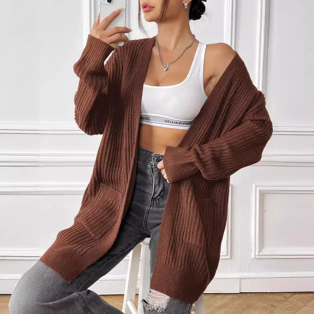 Women's double pocket casual cardigan sweater in dark green, loose mid-length fit.