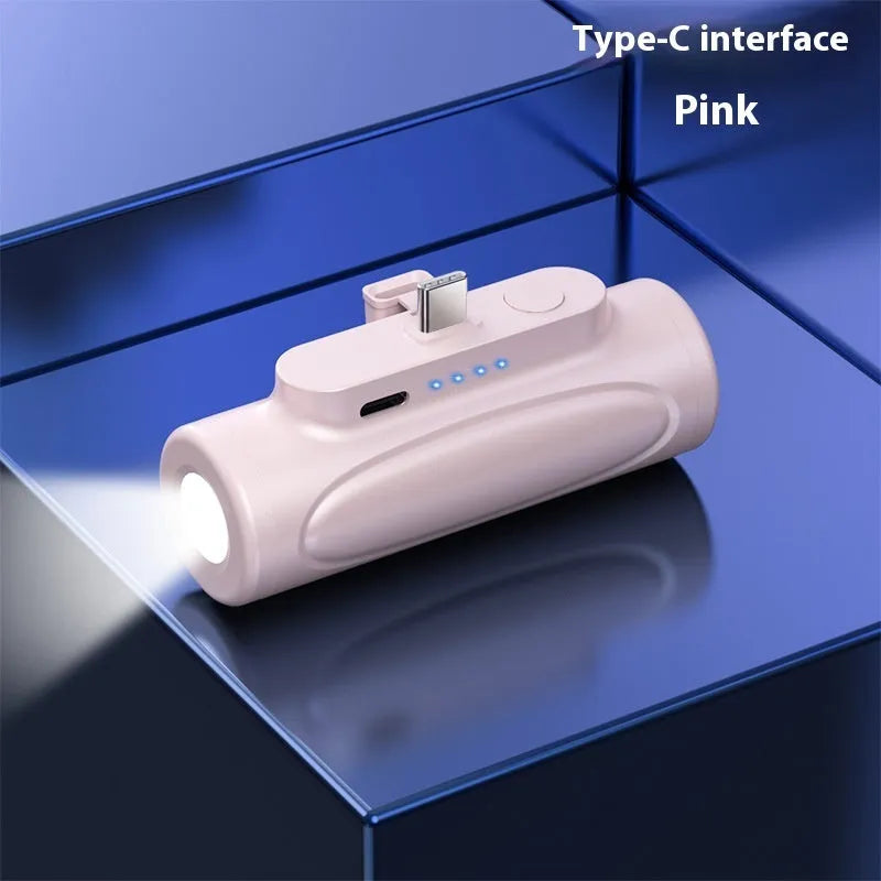 Black creative power bank with LED flashlight showing Type-C port and compact 83x27x41mm dimensions