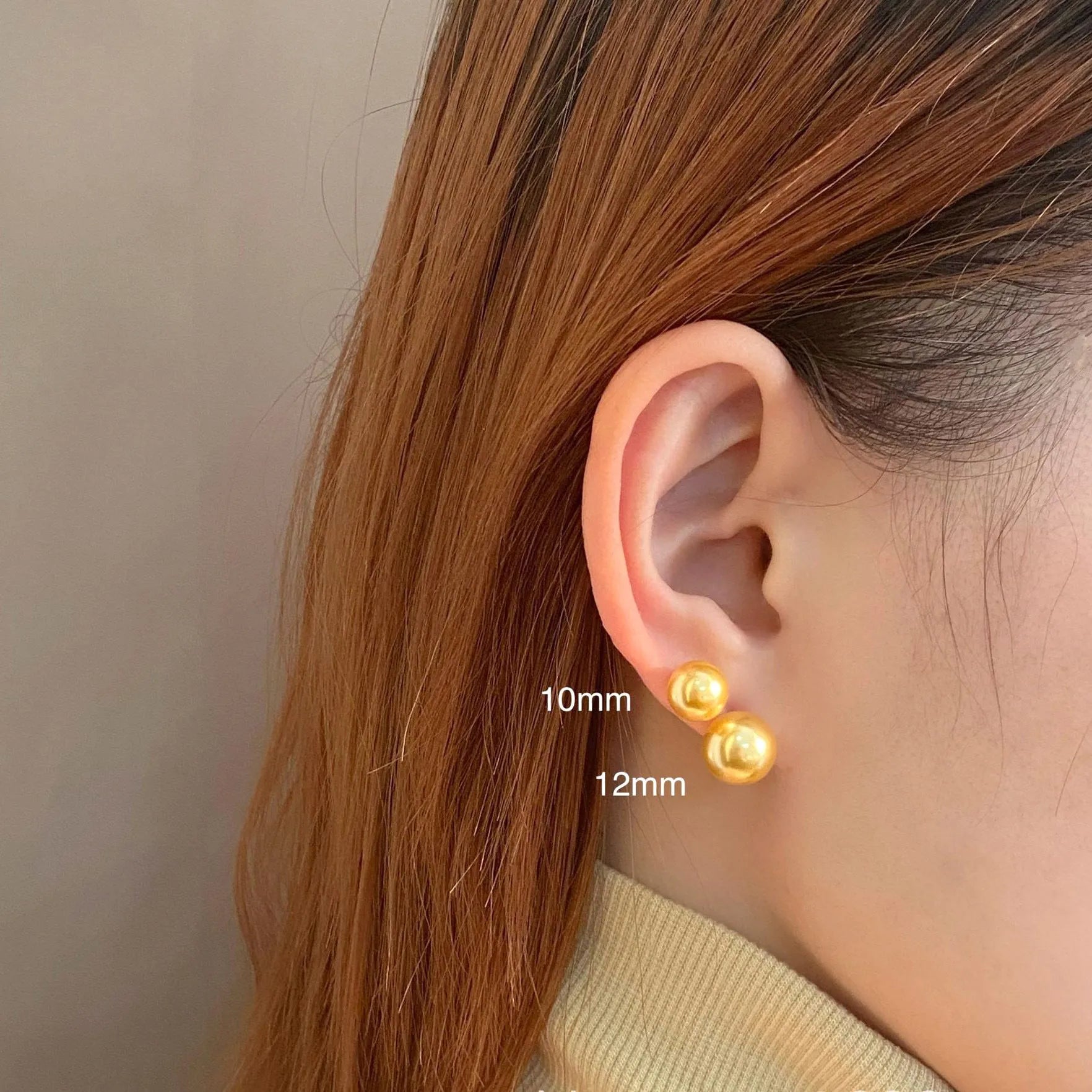 Women's large pearl stud earrings with an eight-pointed star geometric setting in sterling silver.