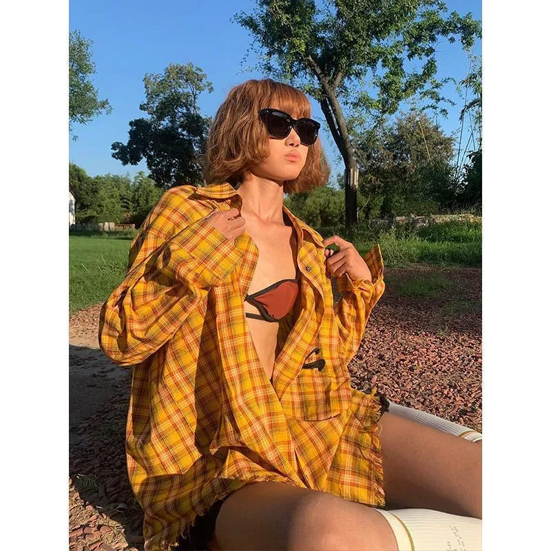 Dopamine yellow plaid shirt on a hanger, showing loose cardigan-style fit.