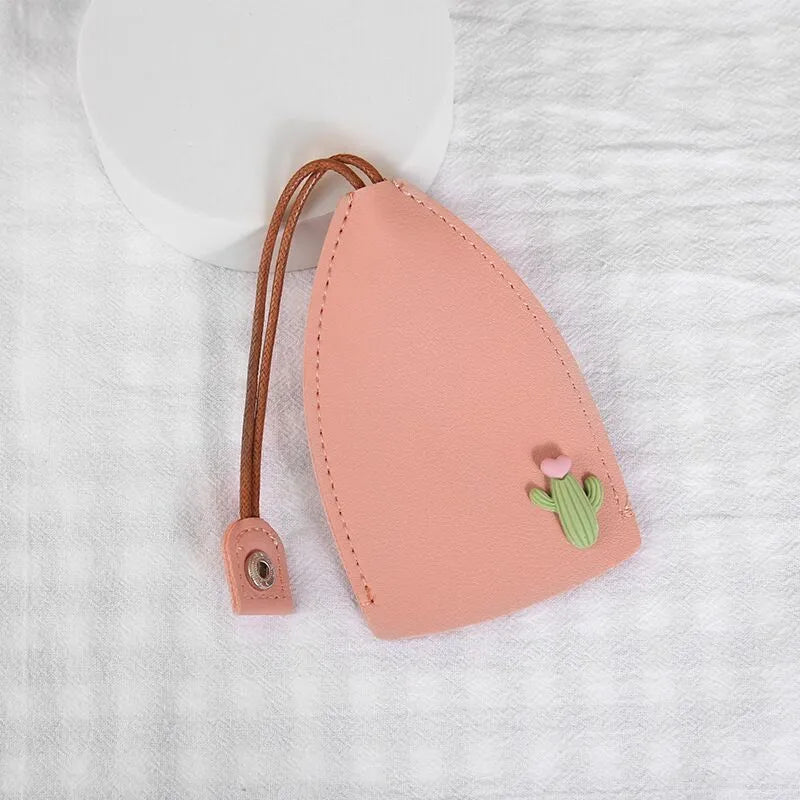 Cartoon design pull-out car key case made from soft PU leather, showing approximate size.