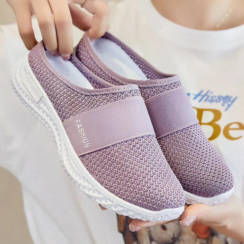 Women's casual shoes with mesh upper and hollow out detailing in round toe shape with flat heel
