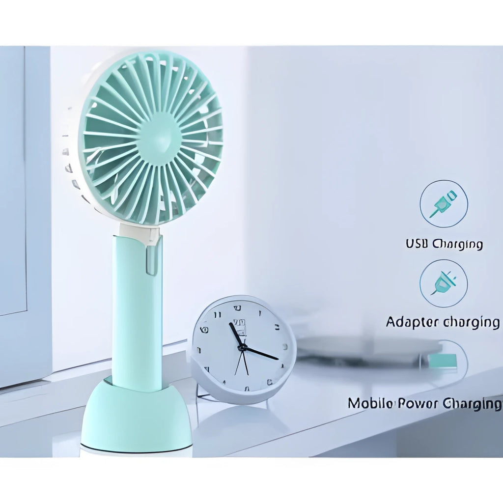 Blue mini handheld and desktop USB electric fan with oscillation on a table