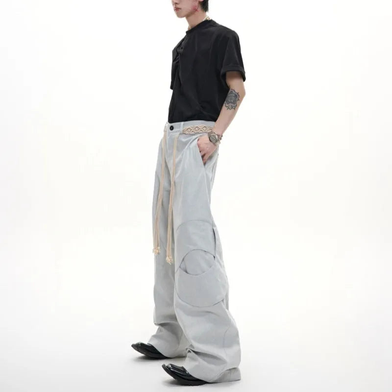 Men's straight leg jeans with 3D texture, belt stitching, and decorative zipper details in dark colour
