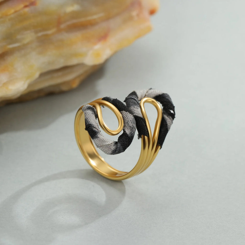 Leopard print geometric open mouth adjustable ring in stainless steel, showing heart shape on finger.