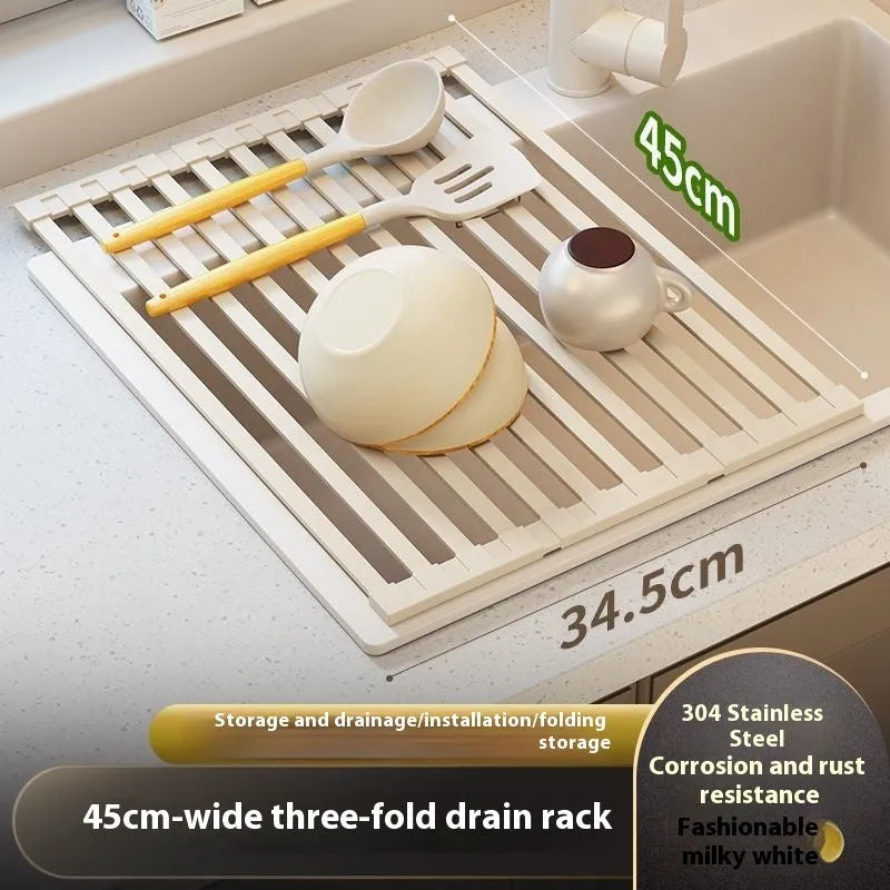 Milky white foldable stainless steel kitchen draining rack next to a sink.