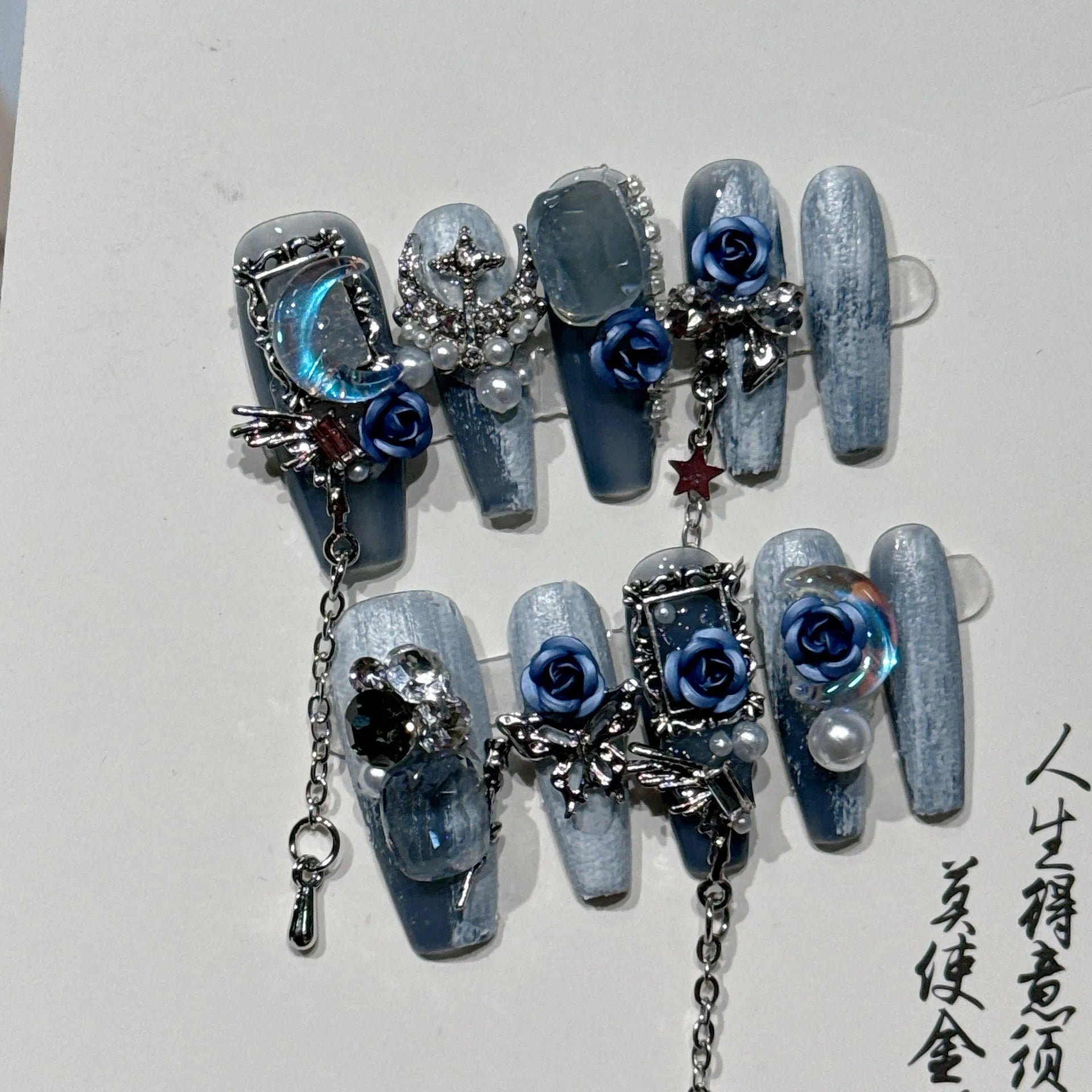 Heavy industry night blue press-on nails with ornate rose and tulip patterns in four sizes XS to L