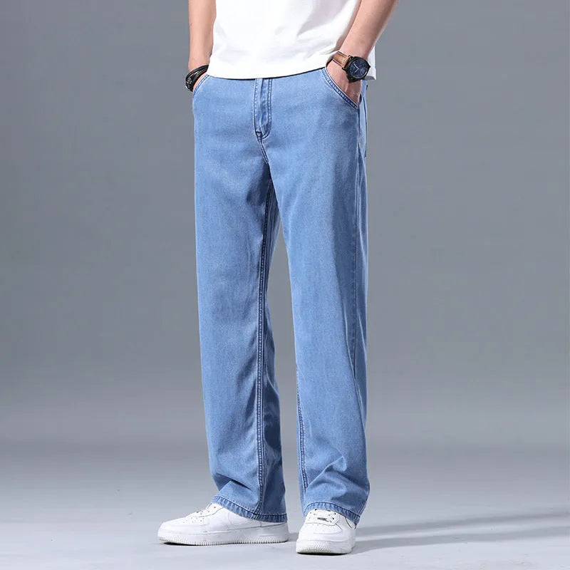Men's loose straight-leg lyocell jeans in blue and grey colour options with zipper fly