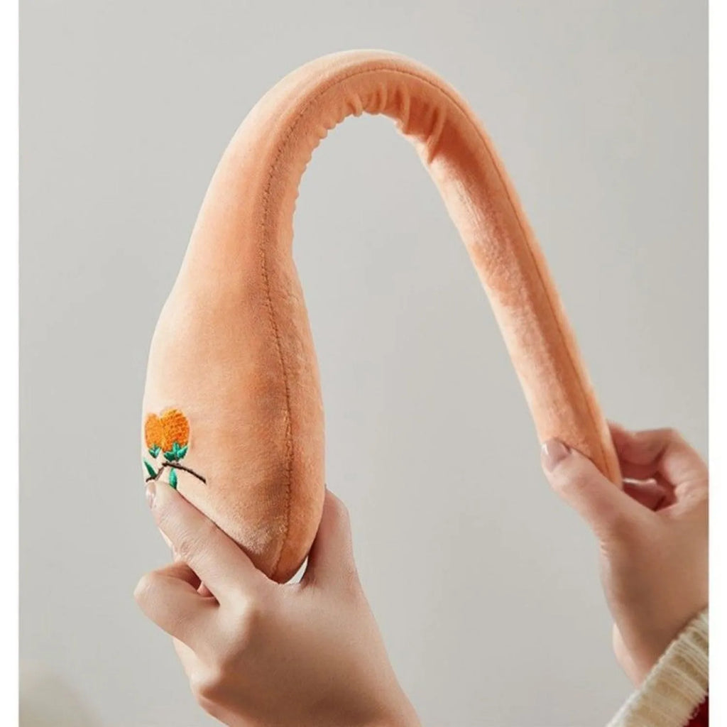 48 cm persimmon coloured back percussion massage stick with zipper detail