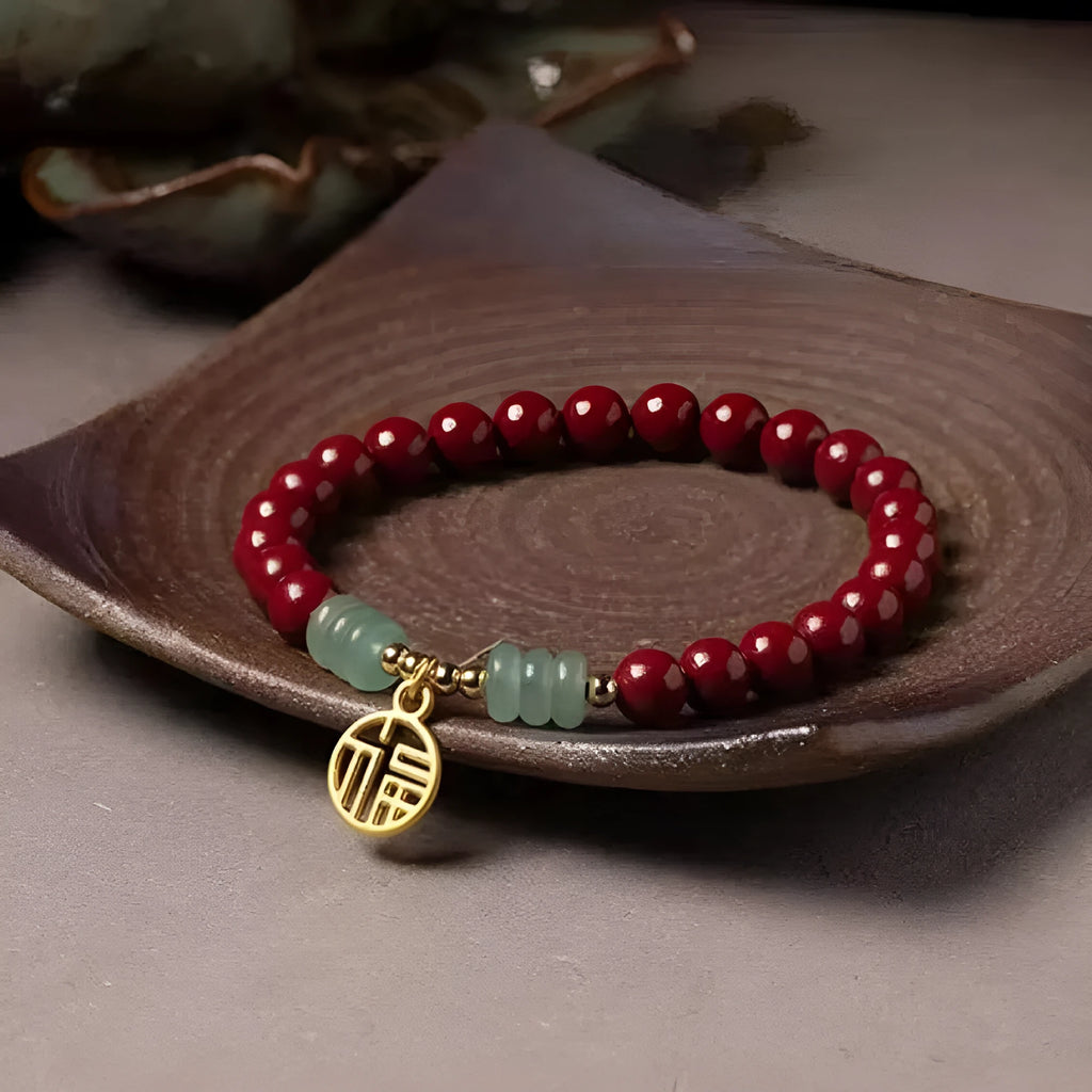 Gold cinnabar bracelet with wave design and copper beads in traditional Chinese style