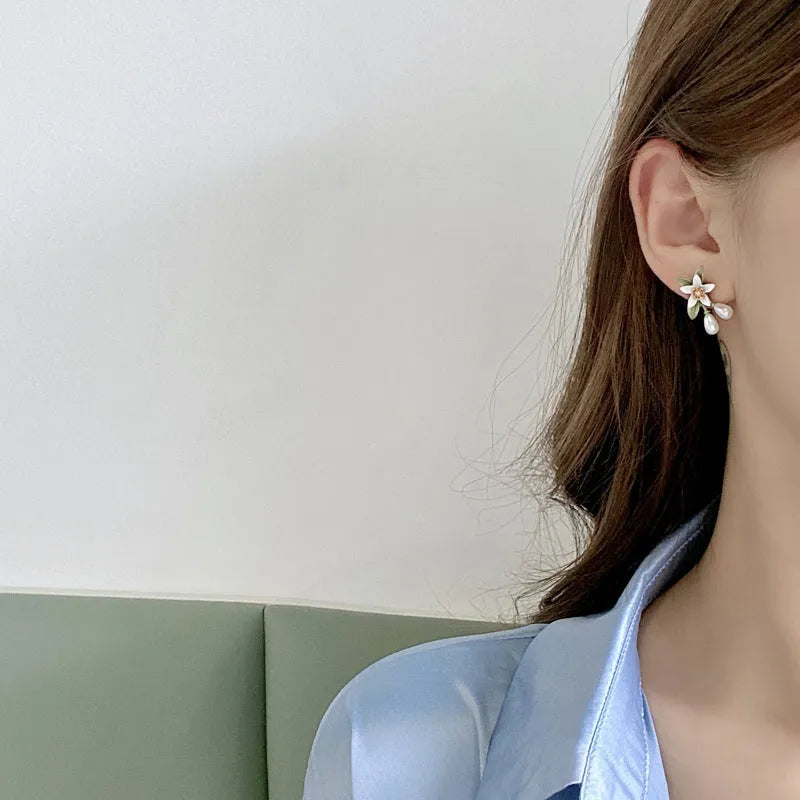 Women's flower ear clip earrings with sterling silver needle flowers and contrast colour alloy metal design