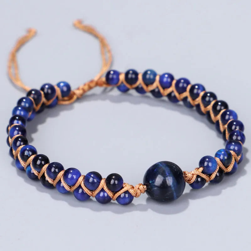 Handwoven geometric pull bracelet in blue tiger eye stone beads with adjustable closure