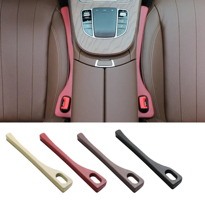 A flexible polyurethane car seat gap filler strip in black, placed between a car seat and centre console.