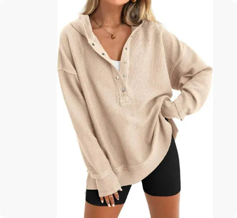 Women's loose fit raglan sleeve sweater in peacock green, shown on a model.
