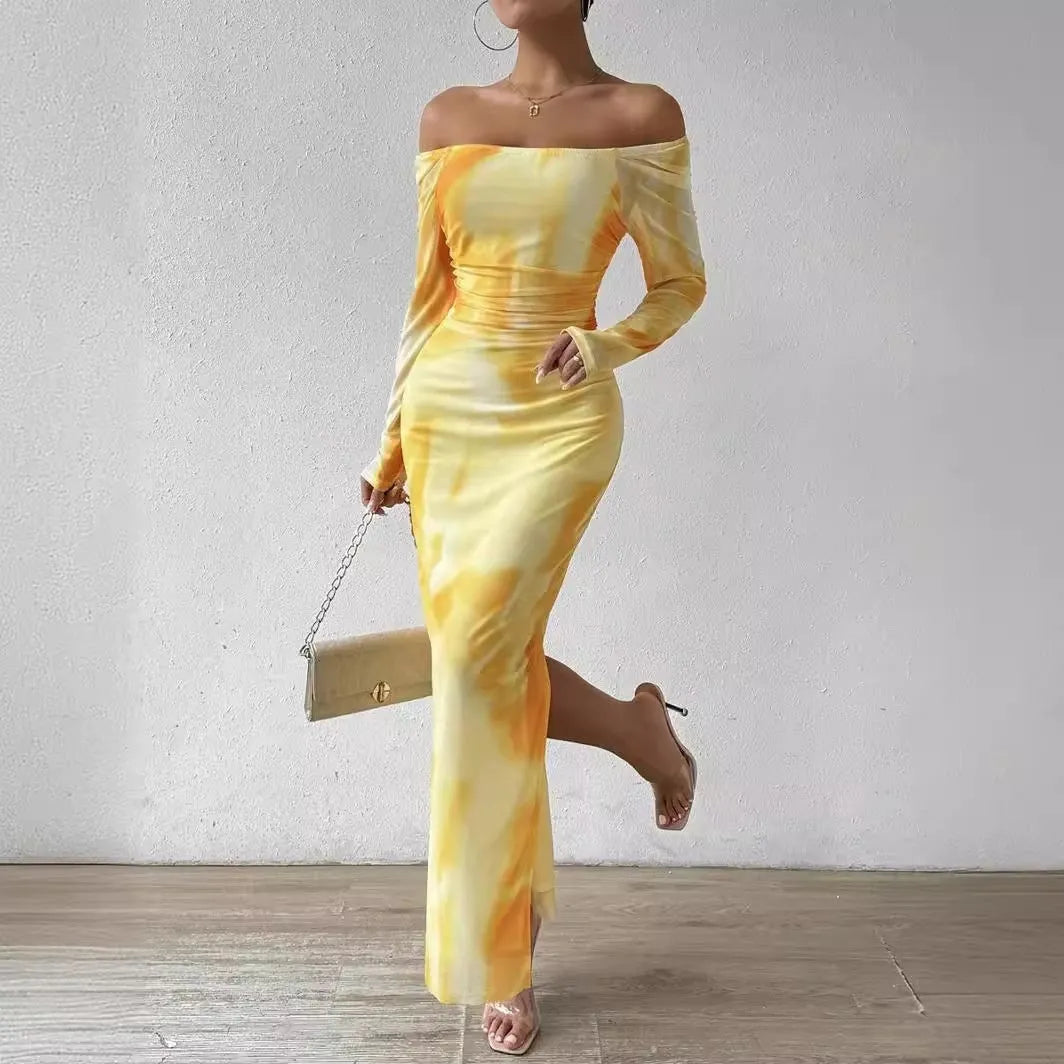 Womens long printed mesh fishtail dress with gradient colour pleating and split skirt detail