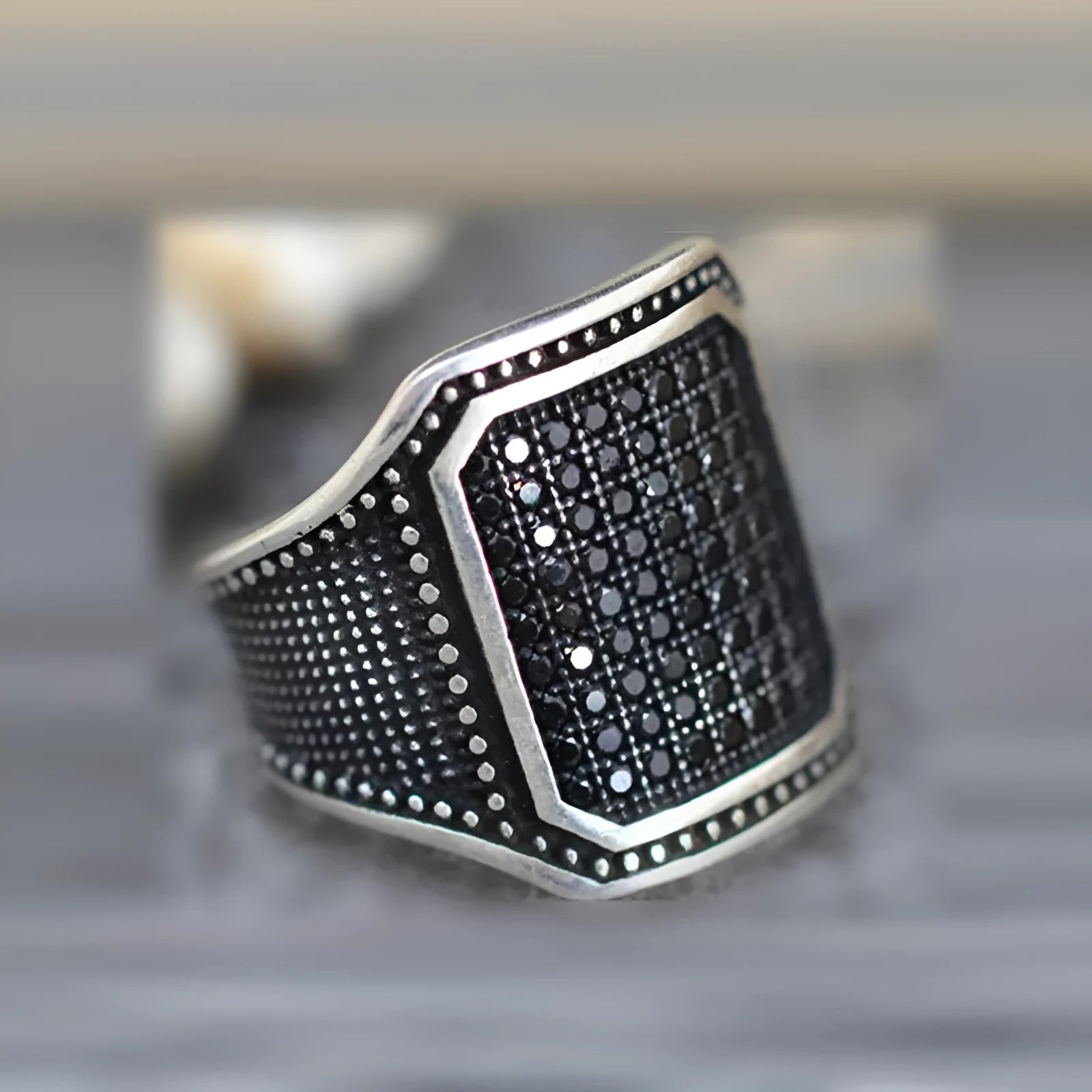 Black alloy ring with copper inlay and zircon stones showing sizes 7 to 13