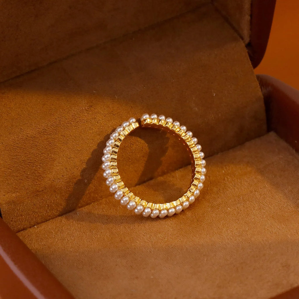 Geometric open mouth ring with electroplated gold finish and round pearl elements