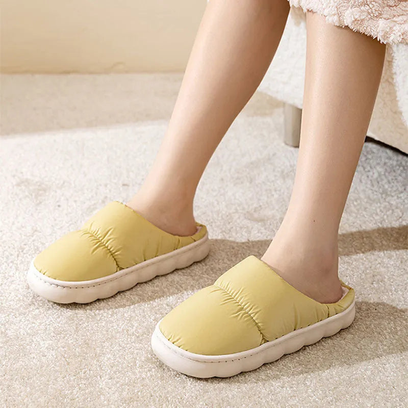 Blue winter slippers with artificial leather upper and thick rubber sole, showing plush lining.