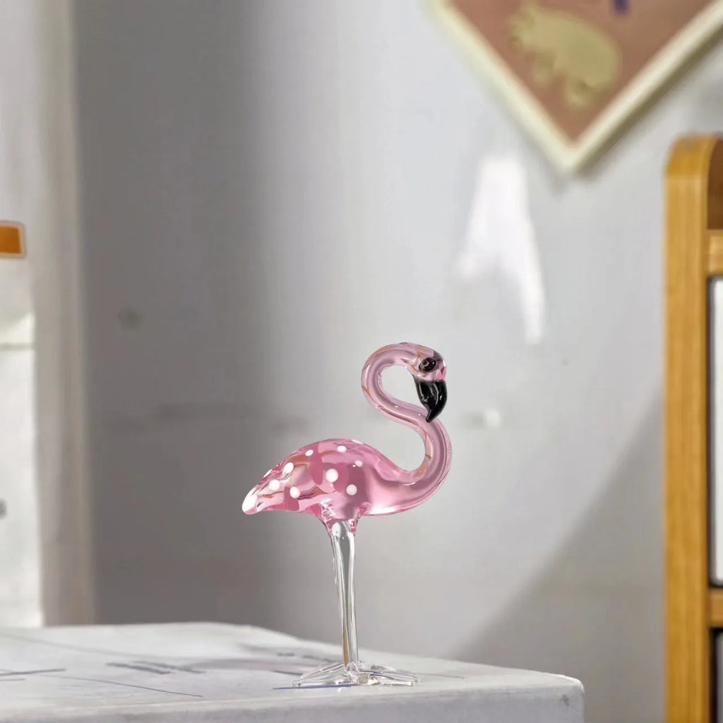 Pink crystal flamingo decorative sculpture on table with modern minimalist design