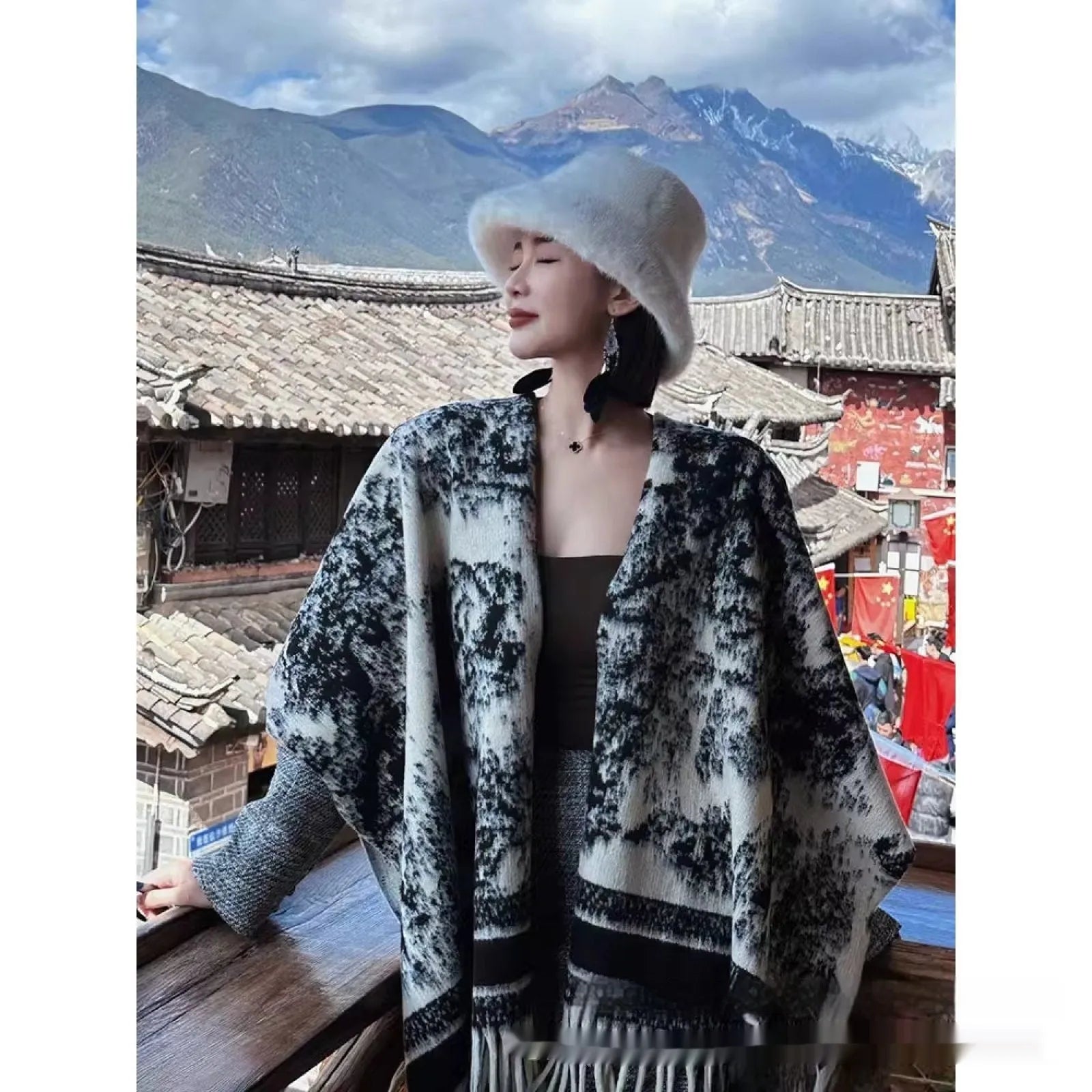 Women's polyester scarf cape with long fringed tassels, shown in a selection of available colours.