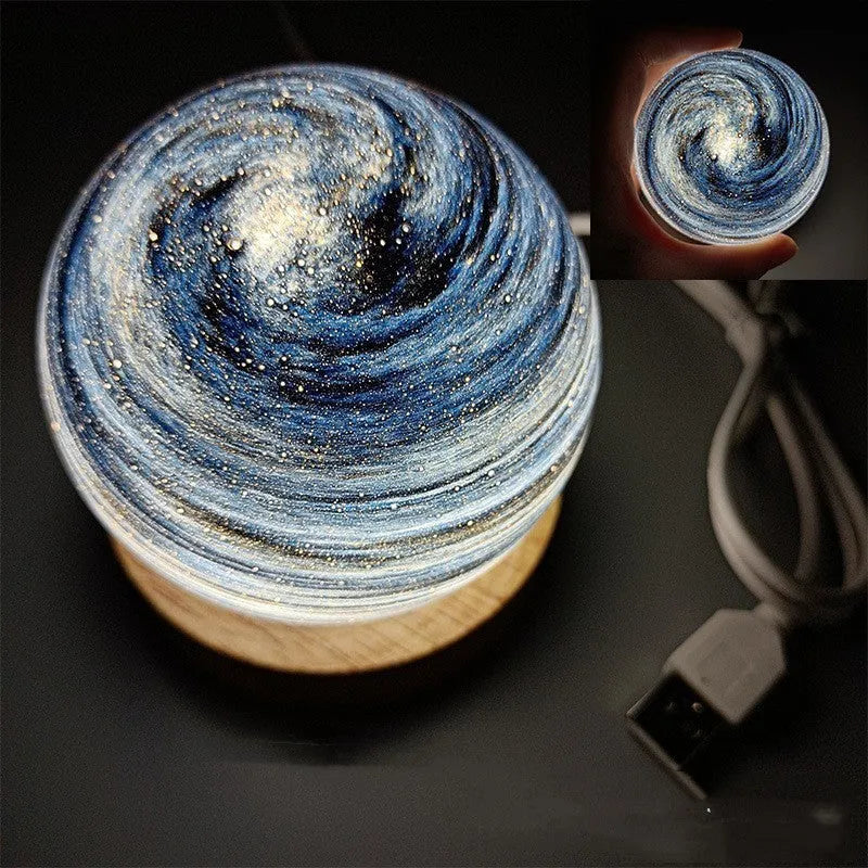 Planet-themed night light with USB cable and base, showing 80mm diameter globe