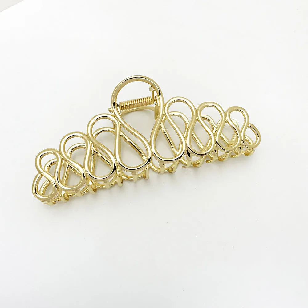 Large gold or silver electroplated alloy hair clip with tassel detail for thick hair updos