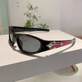 Special-shaped polycarbonate sunglasses with category 3 lenses shown in a black frame and blue lens colour option.