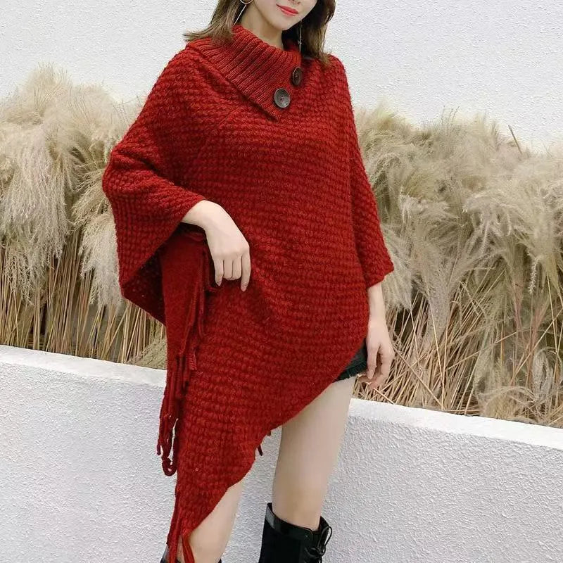 Women's plush cashmere blend triangle shawl cape with tassel trim in multiple colour options.