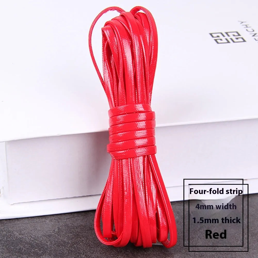 Coils of PU leather craft cord in multiple colours including black, red, blue, and beige