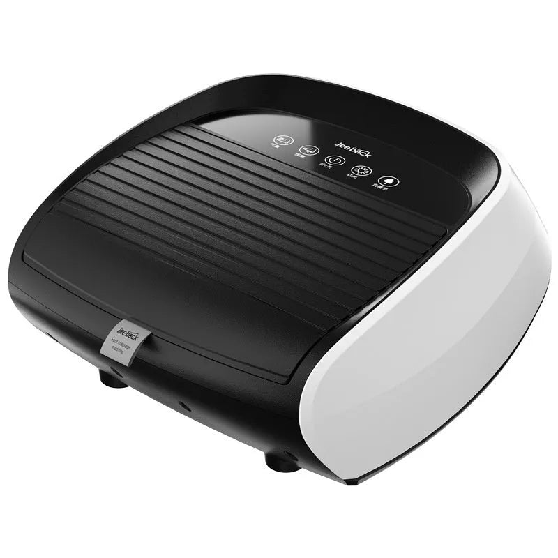 Flip automatic foot massager in black on a floor, showing foot placement area.
