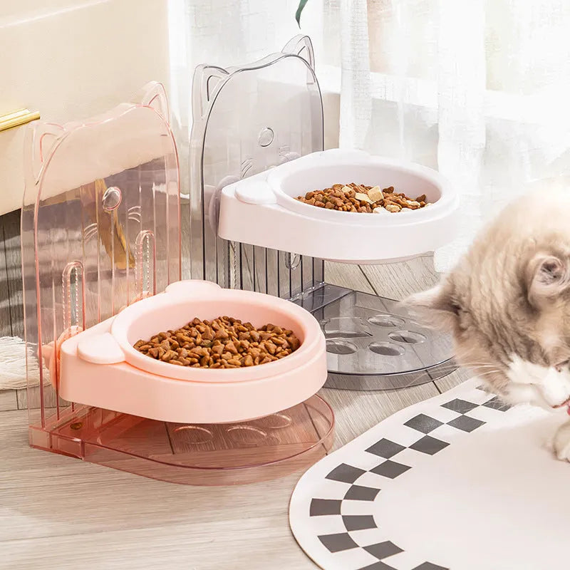 Grey pet bowl with cat ear sides, shown with adjustable height stand and removable cage attachment.