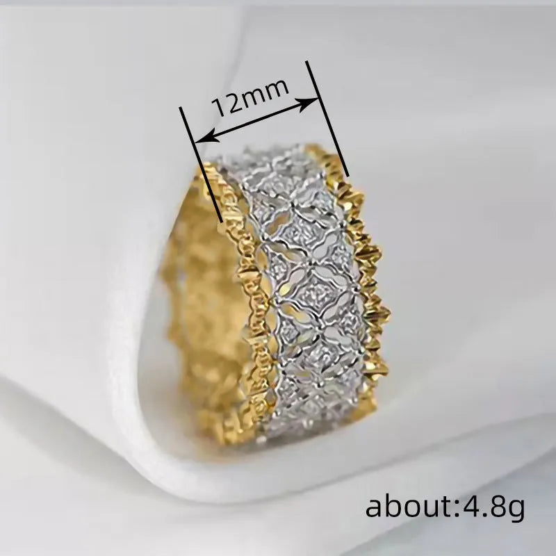 Two-tone gold geometric zircon ring on display showing round shape and electroplated copper construction