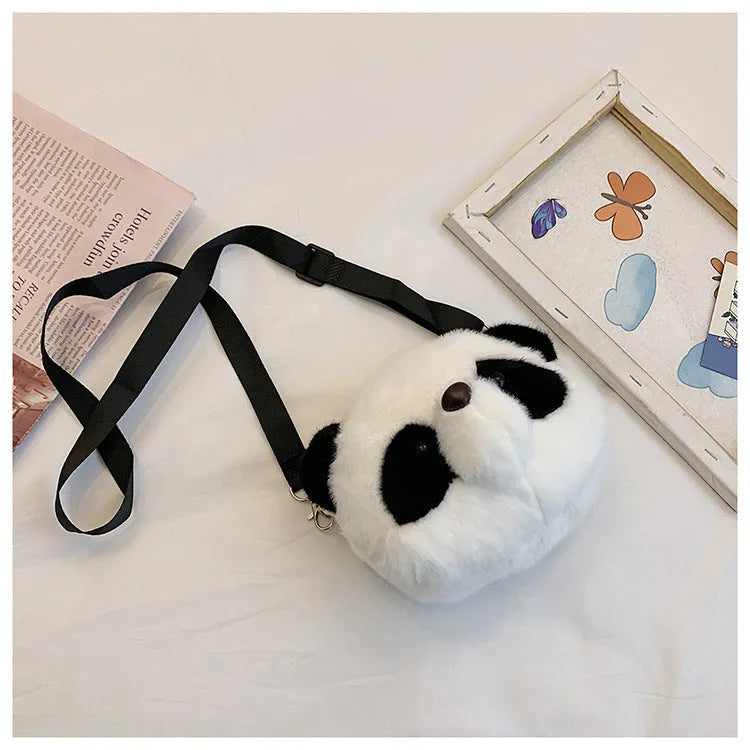 Soft plush cylindrical crossbody bag with panda head design, showing sandwich pocket.
