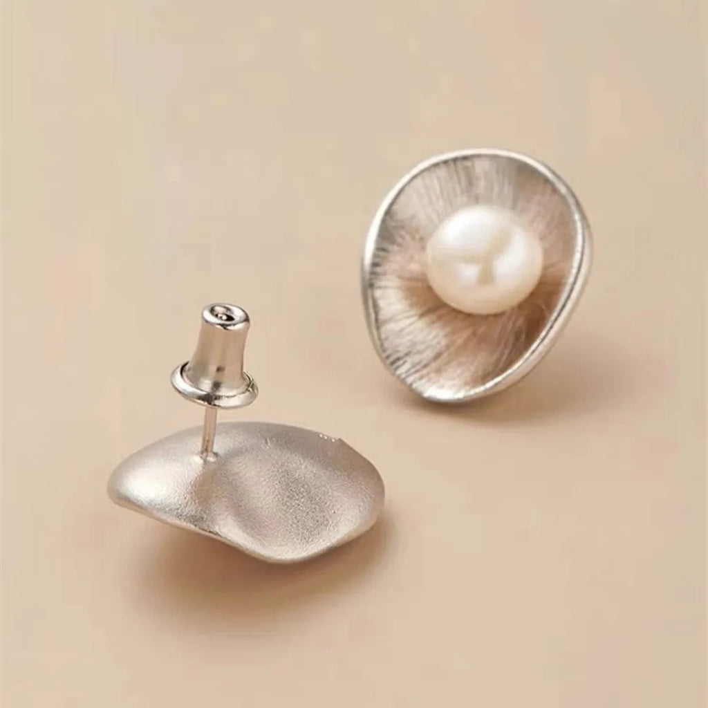 Pearl sterling silver needle earrings with electroplated gold finish geometric design
