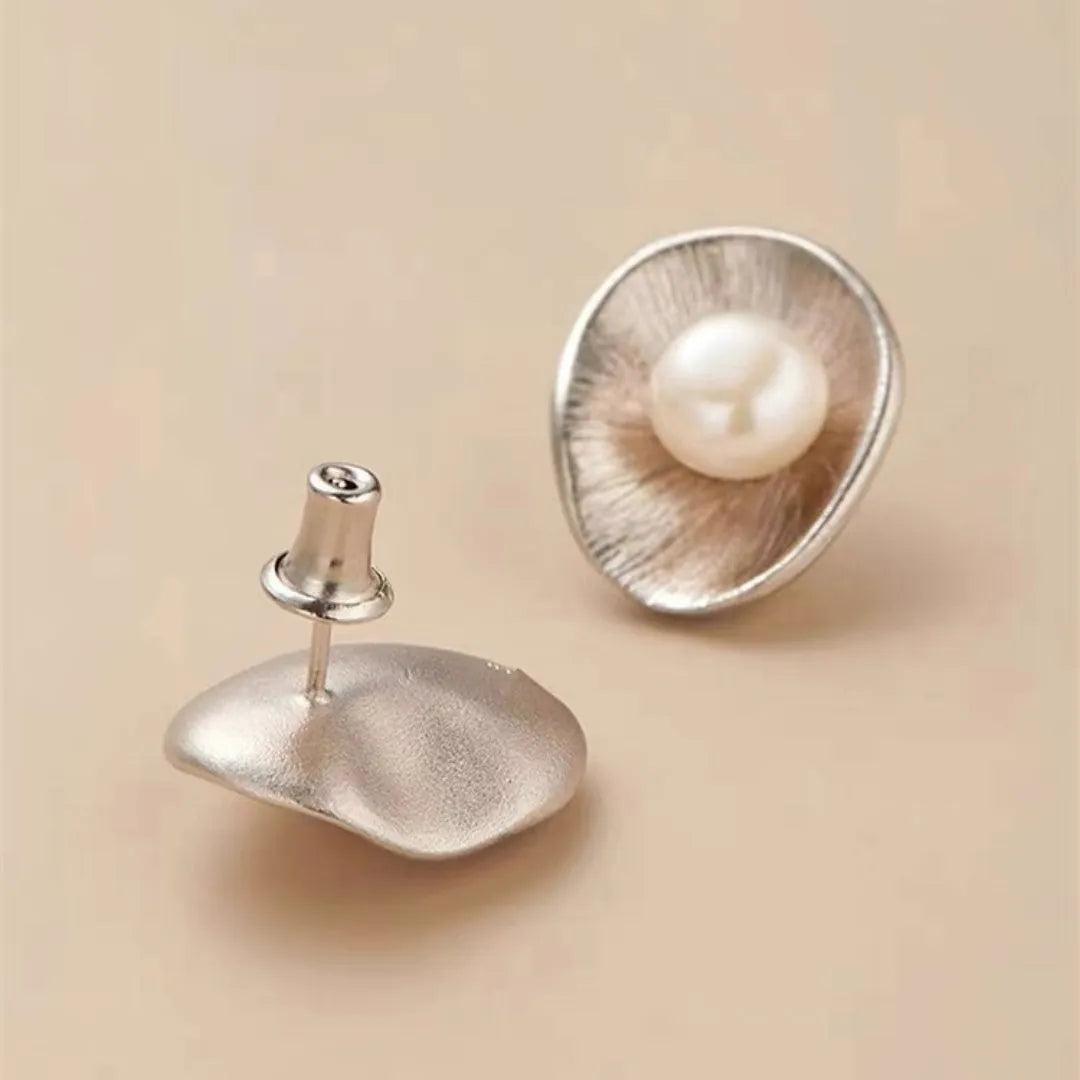 Pearl sterling silver needle earrings with electroplated gold finish geometric design