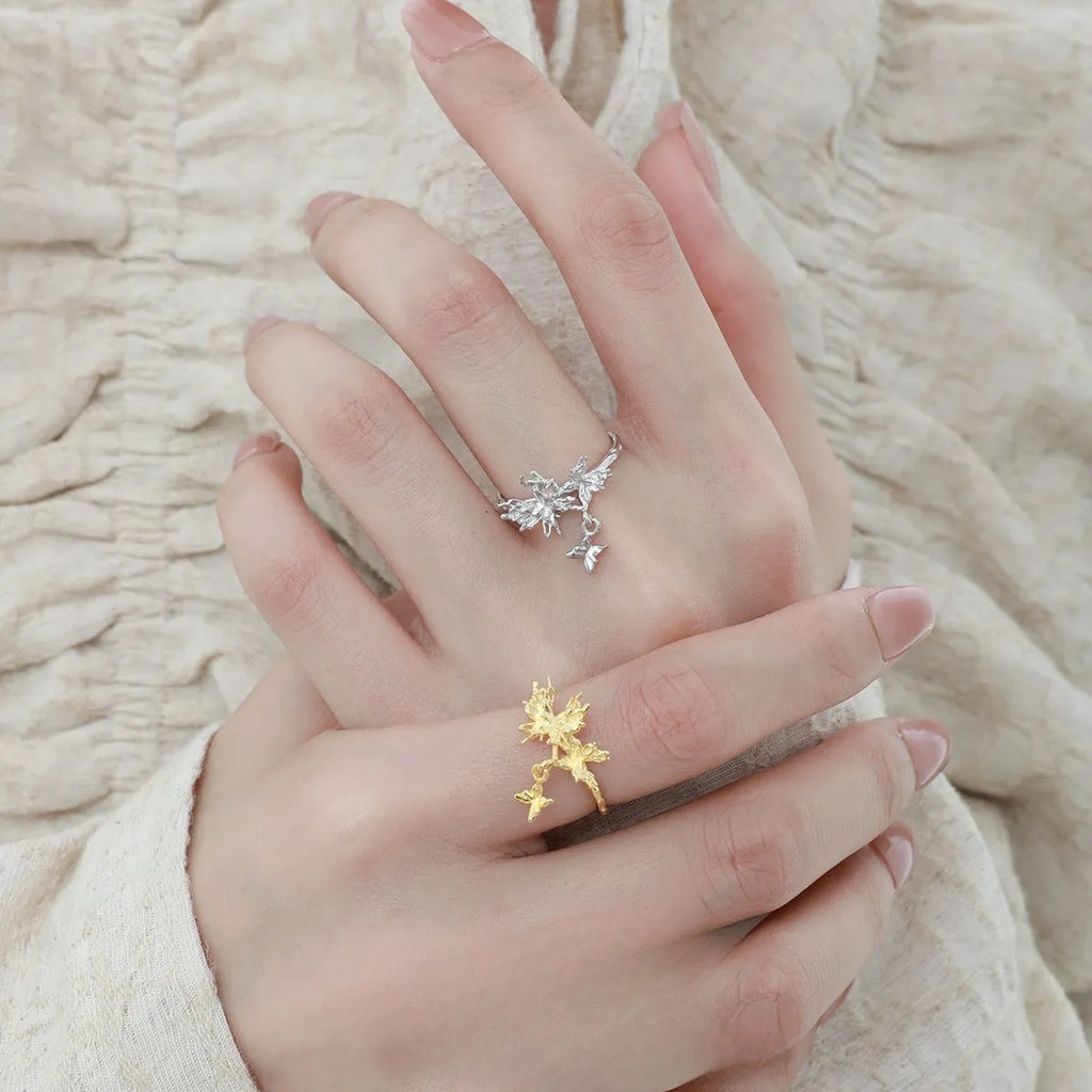 Silver butterfly ring with adjustable opening in white gold or 18K gold colour tone.