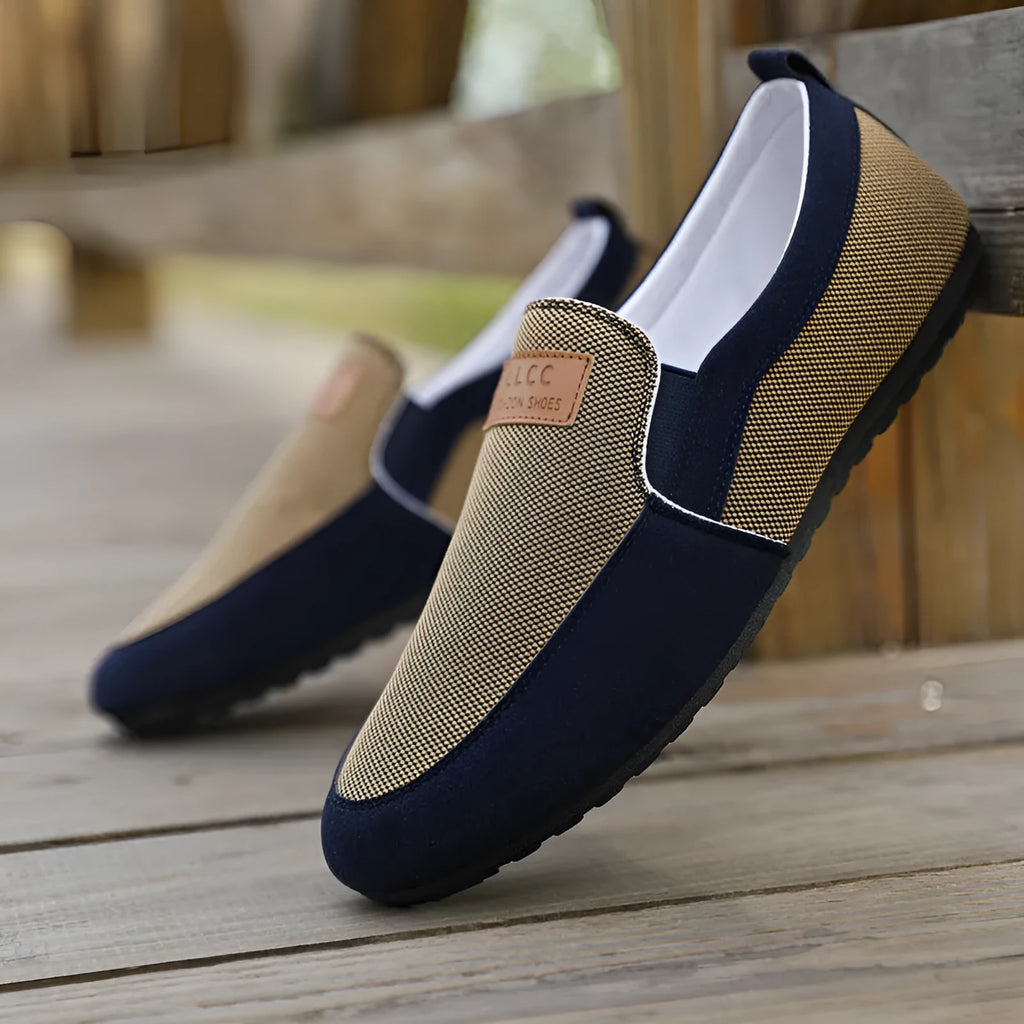 Men's grey and khaki canvas casual board shoes with round toe and stitching detail.