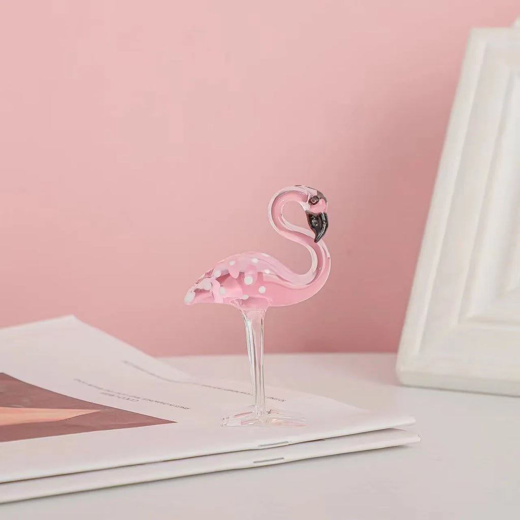 Pink crystal flamingo decorative sculpture on table with modern minimalist design