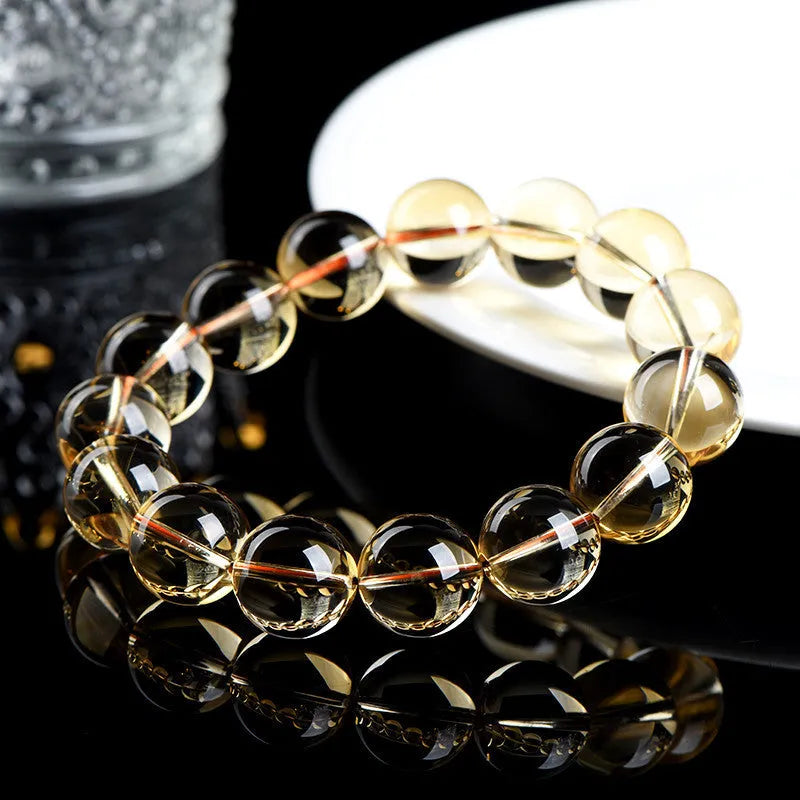 Natural citrine scattered beads ball bracelet showing polished yellow gemstone balls on a string, with colour grade and size options.