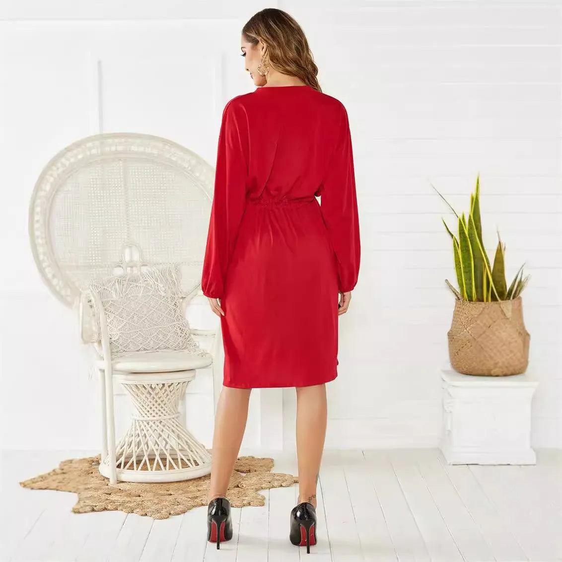 Black A-line dress with elastic waistband and cuffs, mid-length design for professional wear