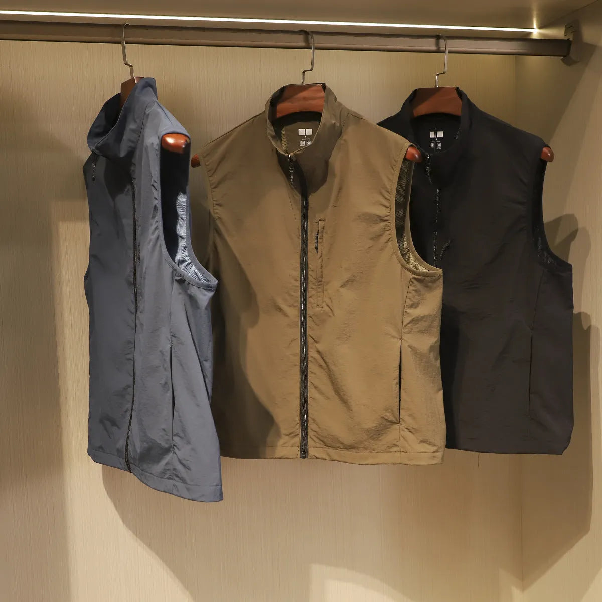 Men's straight-cut nylon vest in Army Green colour with side seam pockets and cardigan style
