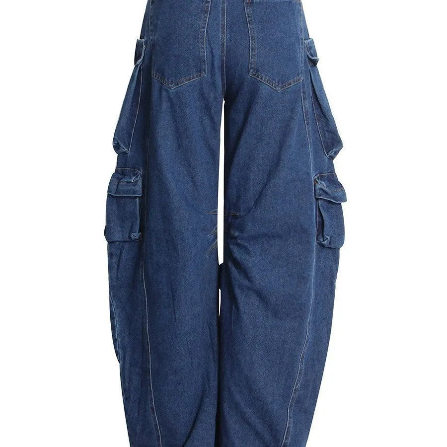 Dark blue distressed wide-leg jeans with a high waist and multiple pockets on a model.