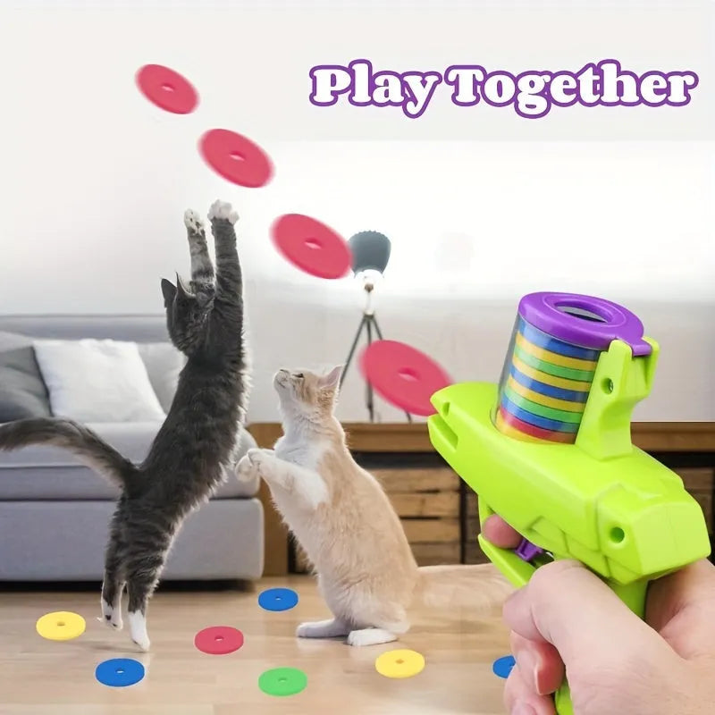 Green interactive cat toy launcher with foam disc for indoor pet play