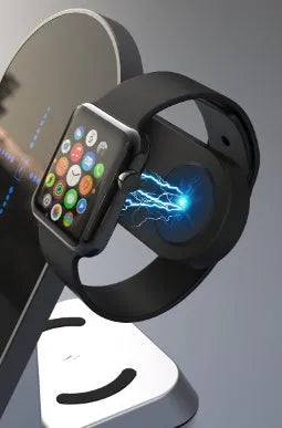Black six-in-one wireless charging alarm clock station on a desk next to a phone and smartwatch.