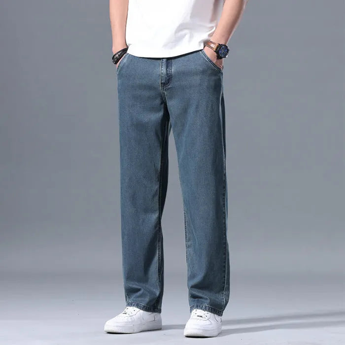 Men's loose straight-leg lyocell jeans in blue and grey colour options with zipper fly