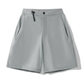 Men's solid colour quick-dry sports shorts with elastic construction for running and climbing.