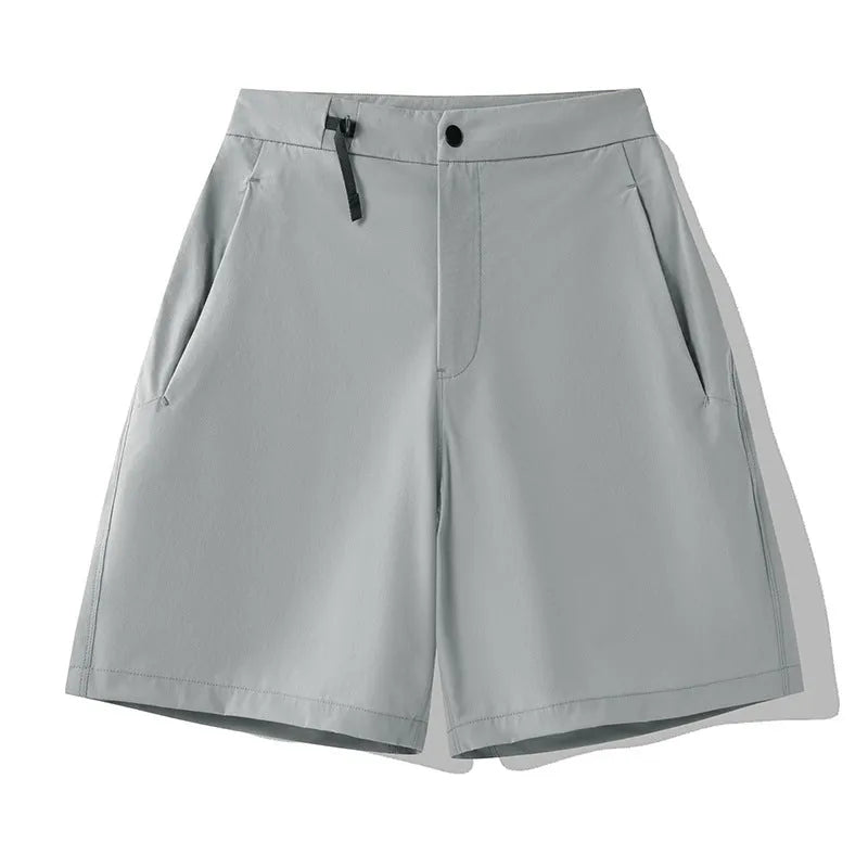 Men's solid colour quick-dry sports shorts with elastic construction for running and climbing.