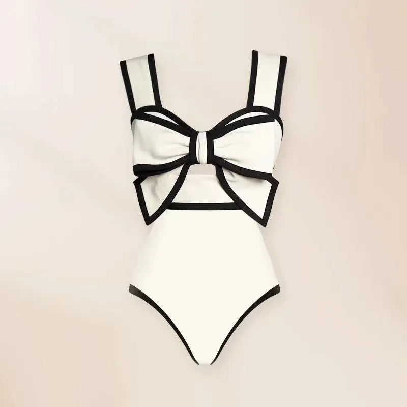 Women's one-piece swimsuit with beach dress style featuring bow detail and round skirt in polyester fabric